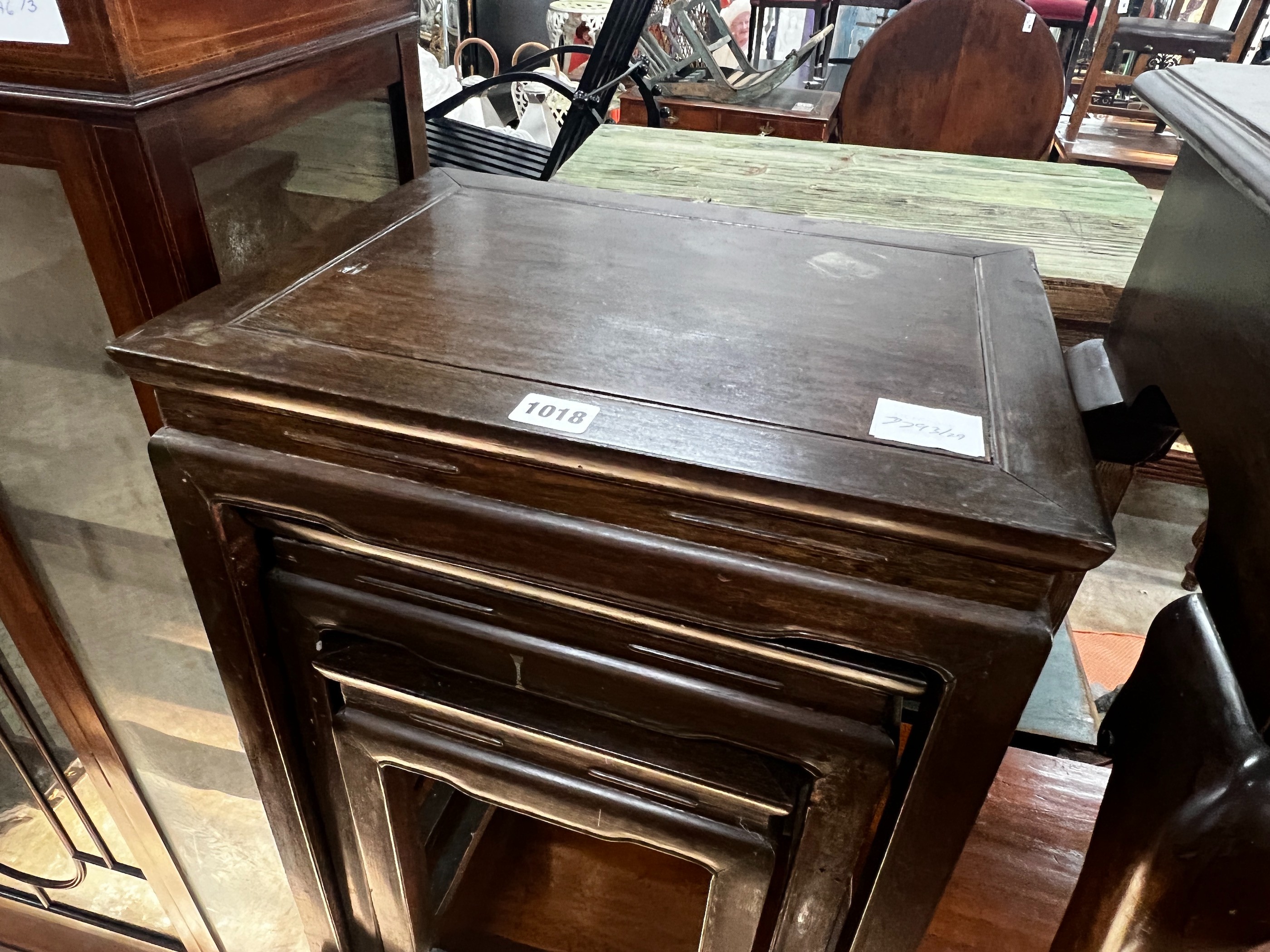 A nest of three Chinese hardwood tables, width 41cm, depth 32cm, height 59cm